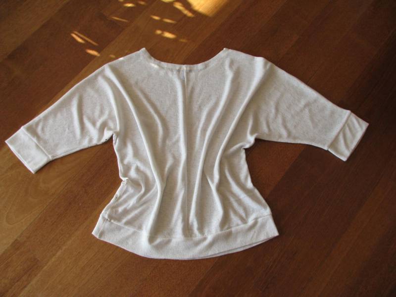 ox_luzny-bialy-sweterek-bluzka-z-cekinkami-l-xl